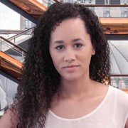 Striking young woman with long dark curly hair